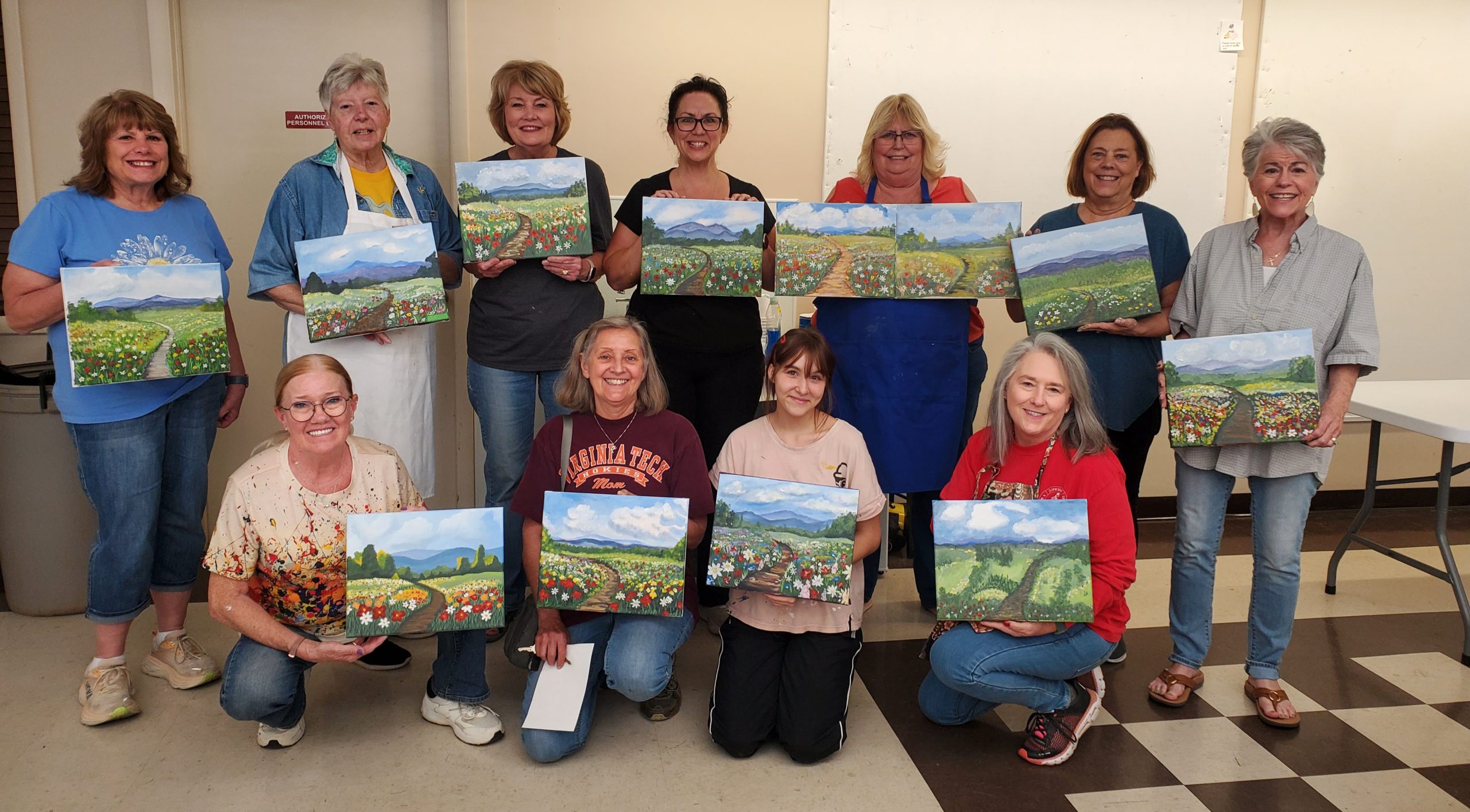 happy students share their painting created in class